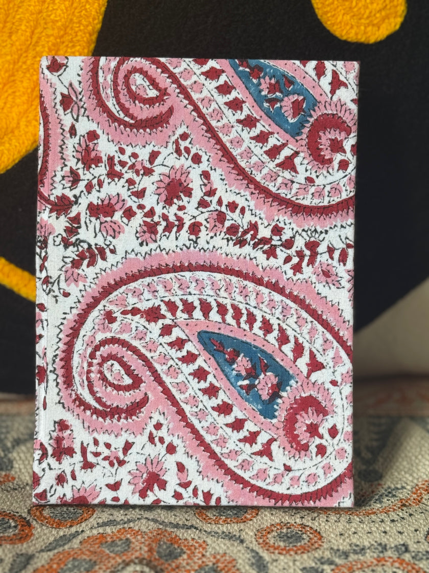 Handblock printed pink paisley patterns on diary