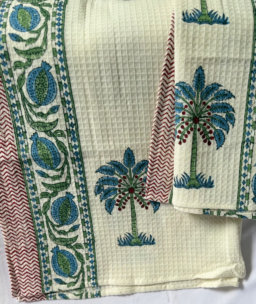 Textile with palm tree design on a white background