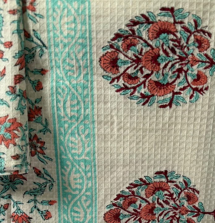 Decorative  cotton towel with floral patterns on a white background