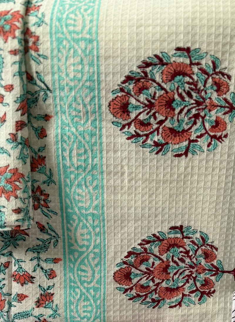 Decorative  cotton towel with floral patterns on a white background