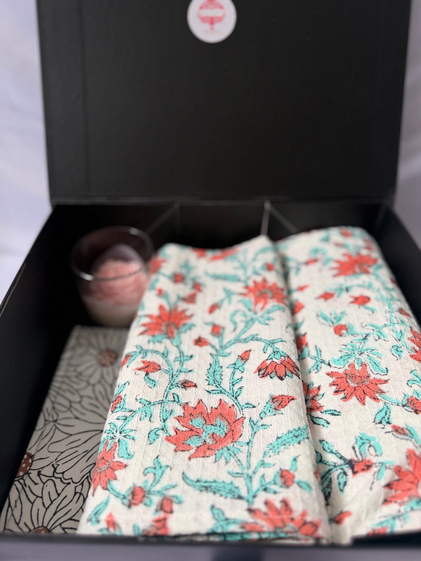 Textile with floral patterns and a striped border on a white background