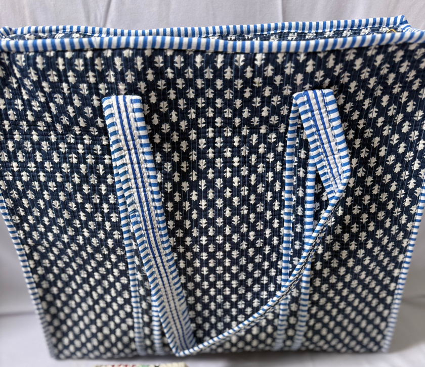 Textile bag with blue and white pattern on a plain background