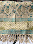Rug with floral patterns and fringes on a white background