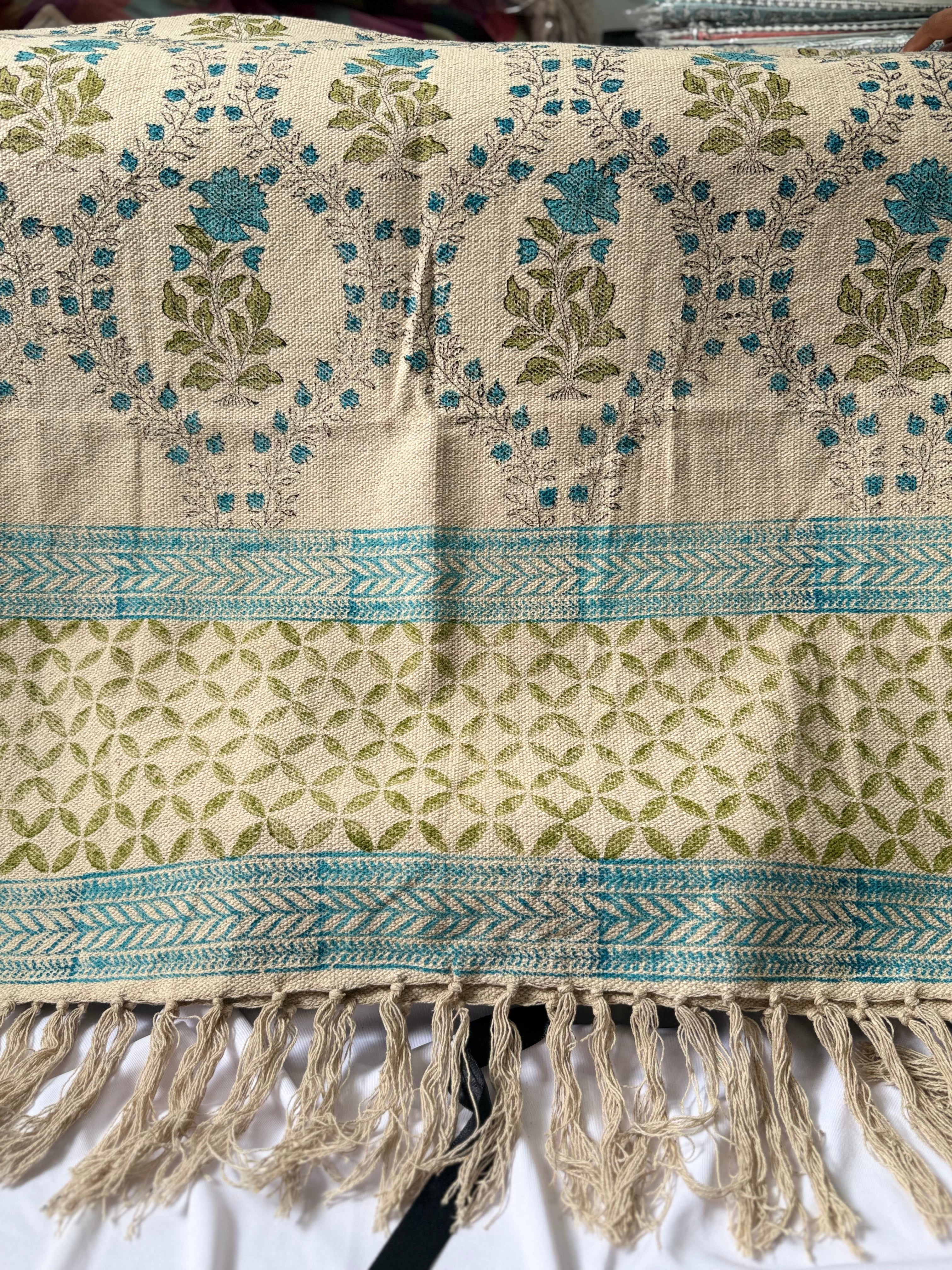 Rug with floral patterns and fringes on a white background