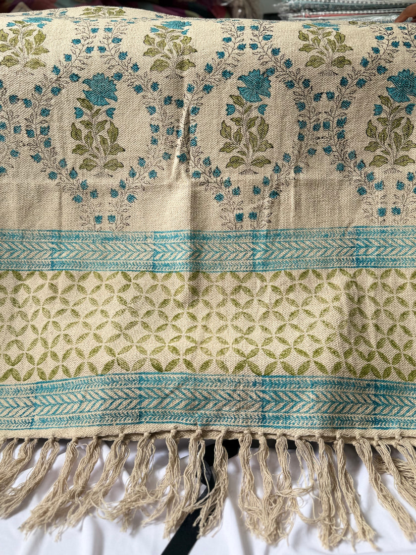 Rug with floral patterns and fringes on a white background