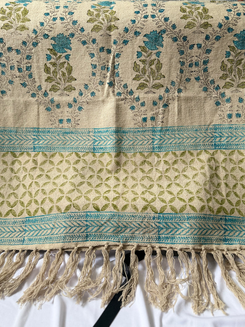 Rug with floral patterns and fringes on a white background