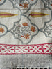 off white rug with floral patterns