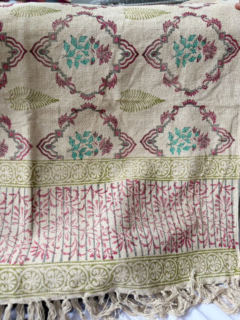 Textile product with pink floral pattern in a black box on a white background