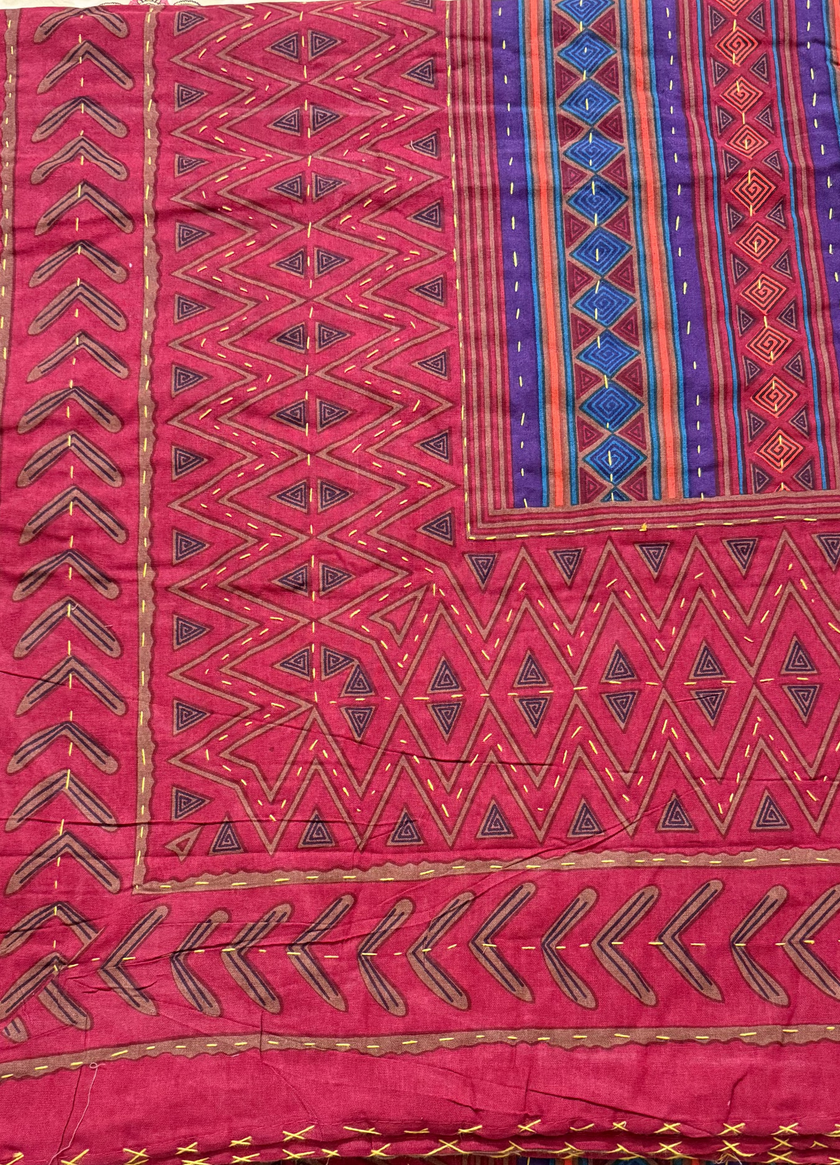 Traditional patterned fabric on a table with decorative edge